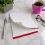 Professional personalized memo pad with a title and full name, red accent border, and top sheet curling from the pad.