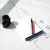Custom writing pad personalized with an honorific and three-part name, shown with a fountain pen and blue accent border.