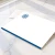 Blue-bordered personalized flat notecard with blue monogram and coordinating envelope