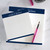 Custom square notepads with "From the Desk of" typewriter-style name in navy ink