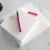 Large square initial notepad in use—smooth, thick pages for daily notes