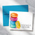 Personalized folded note cards featuring a stack of colorful French macarons and a printed name