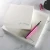 Writing a list on a personalized square notepad