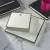 Olive-bordered personalized square notepads with green monograms, coffee, and desk styling