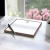 Brown-bordered personalized square notepad with monogram, styled on a desk