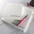Two layered Holla Swash square notepads with royal-blue script names, shown with a pink fountain pen and black ink bottle.