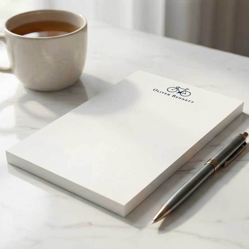 Personalized Bicycle rectangular notepad styled on a calm desk as a thoughtful gift for him