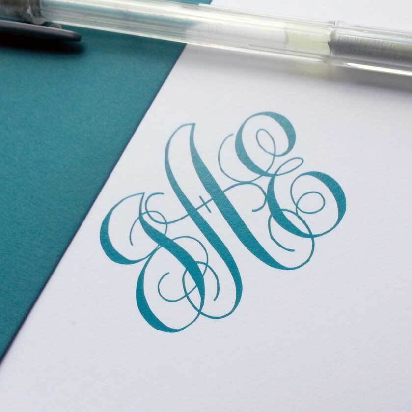 Luxury personalized stationery with teal monogram printed on premium white cardstock