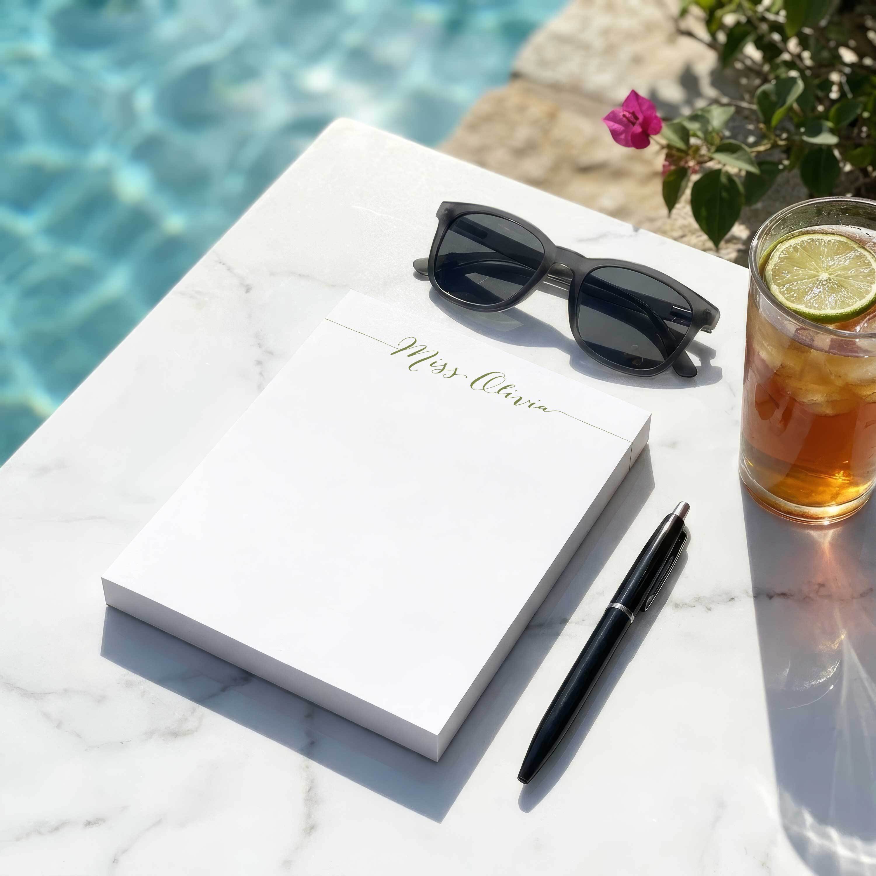 Personalized Miss Olivia notepad styled poolside as a useful teacher gift