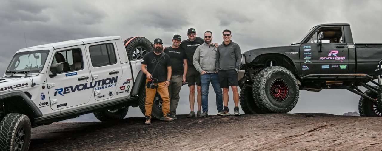 The Revolution Gear & Axle crew with the Revolution Jeep Gladiator and trail truck in Moab, Utah