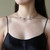 Modern Art Jewelry on model from Morgan Amirani | Argentium Silver Lets Connect Choker with 18 Karat Gold and Ruby accents. Modern Art Jewelry on model from Morgan Amirani | Argentium Silver Lets Connect Choker with 18 Karat Gold and Ruby accents.