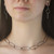 Modern Art Jewelry on model from Morgan Amirani | Argentium Silver Lets Connect Choker with 18 Karat Gold and Ruby accents. Modern Art Jewelry on model from Morgan Amirani | Argentium Silver Lets Connect Choker with 18 Karat Gold and Ruby accents.