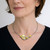 Contemporary Jewelry, Leaf Cluster Necklace by Judith Neugebauer on Model | Sterling Silver and 23 Karat Gold leaf