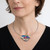 Cloisonne Enamel Jewelry from Sheila Beatty | Fine Silver and Sterling Silver | Green Tourmaline and Trilliant Aquamarine | 14 Karat and 22 Karat Gold | Wings Necklace on model with 16" chain