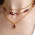 Modern Art Jewelry | Rubellite Cabochon set in a Hand-Fabricated 22 Karat Gold Bezel  on a gold chain | Granulation  Modern Art Jewelry | Rubellite Cabochon set in a Hand-Fabricated 22 Karat Gold Bezel  on a gold chain | Granulation