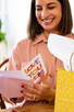 Women holding love you mom card