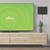 mohu leaf 50 TV antenna on a wall next to a TV in a living room