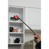 Hand using the Drive RTL5020 reacher to take a can from a kitchen cabinet shelf