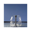 Fountain nozzle creating a clear dome-shaped water effect in a pond. Fountain nozzle creating a clear dome-shaped water effect in a pond.
