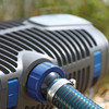 AquaMax Eco Premium pump connected to pond tubing with a hose clamp.