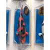 Realistic Hi Utsuri koi replica featuring bold red and black markings, displayed in a clear plastic case with a blue background.