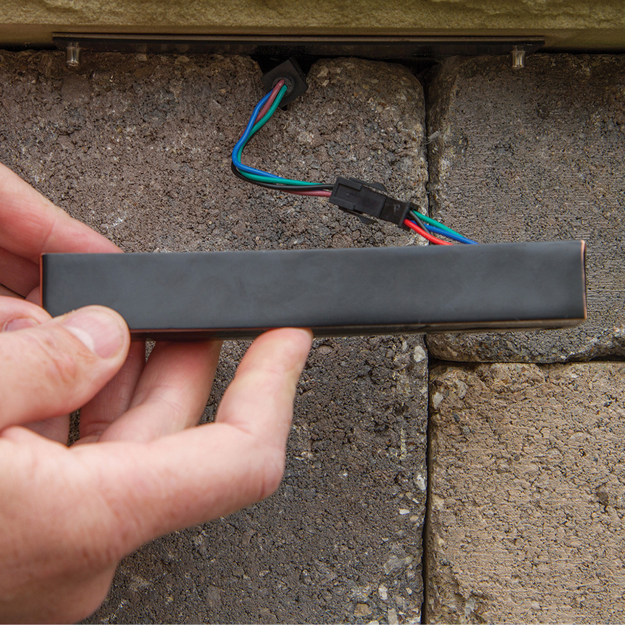 LED light bar with mounting bracket and wiring for pond or water feature installation.