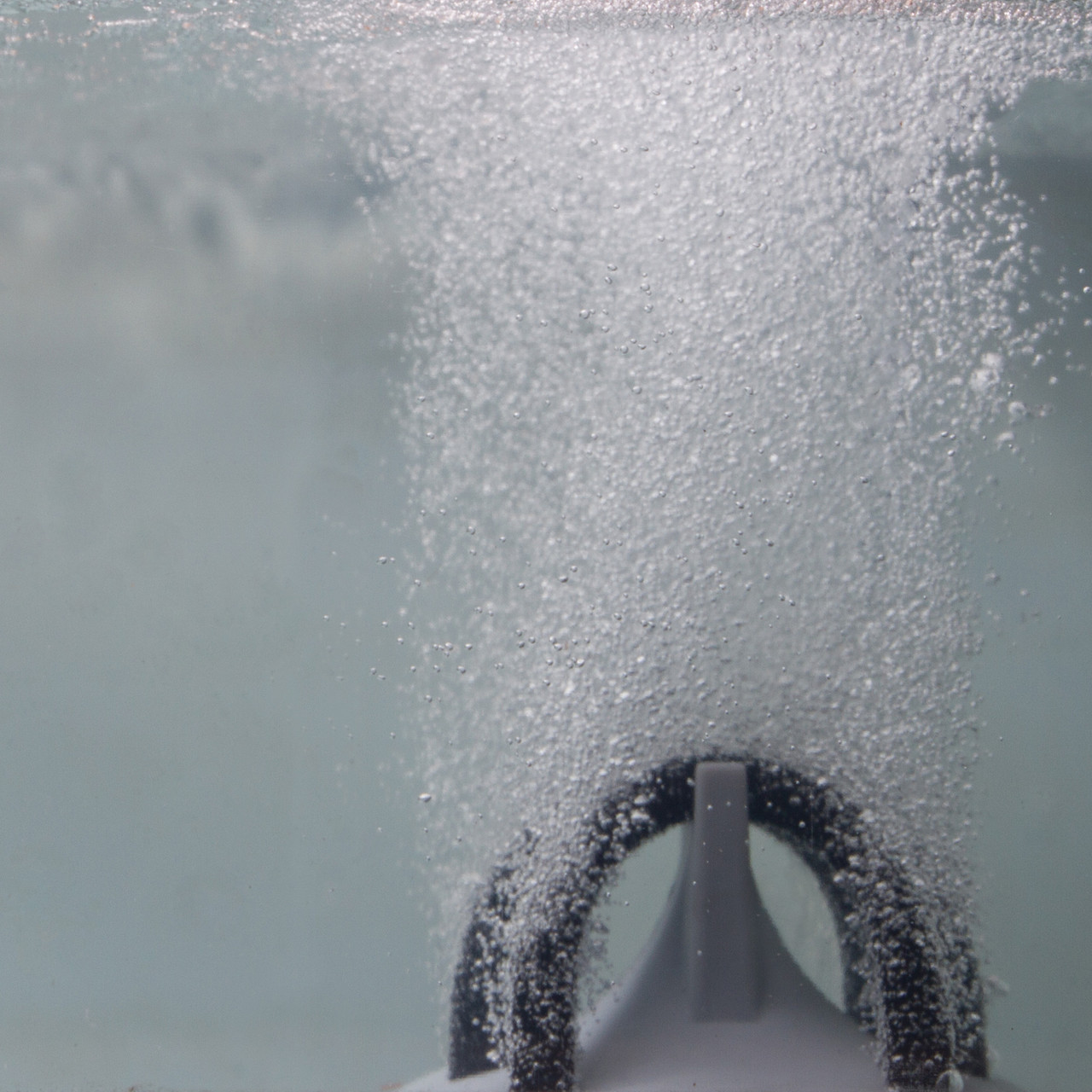 Complete pond aeration kit with storage box, two diffusers, and coiled black tubing.