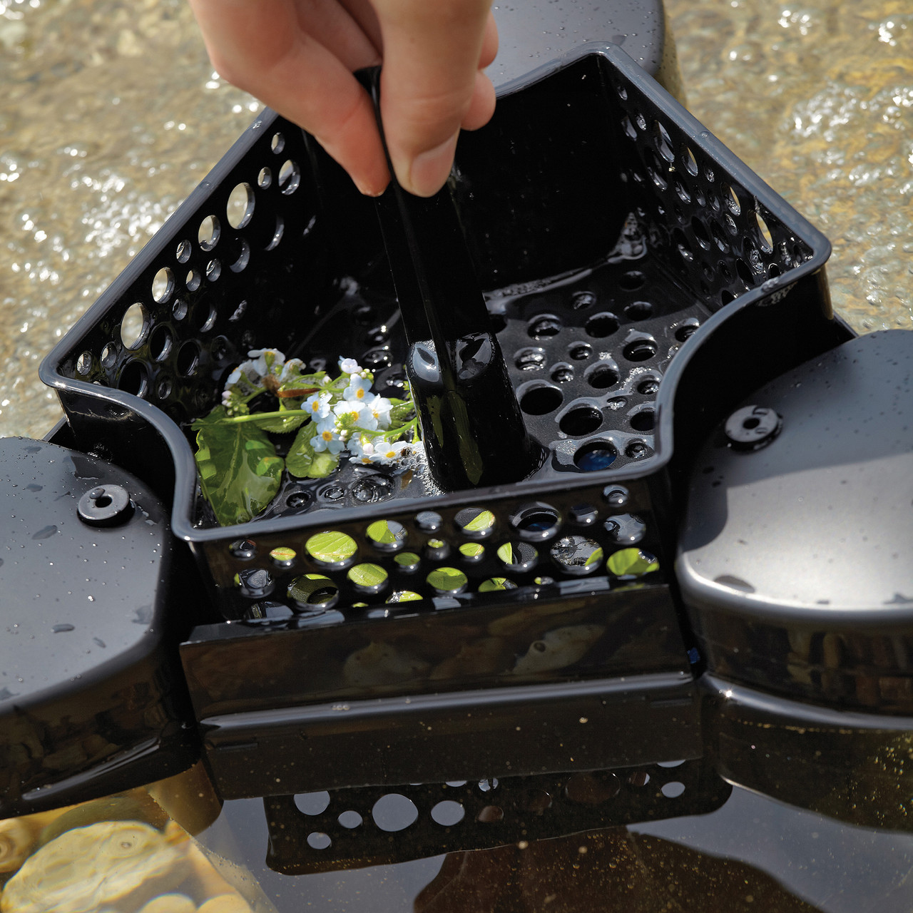Black pond filter box with three removable lids and internal compartments for filtration system. Black pond filter box with three removable lids and internal compartments for filtration system.