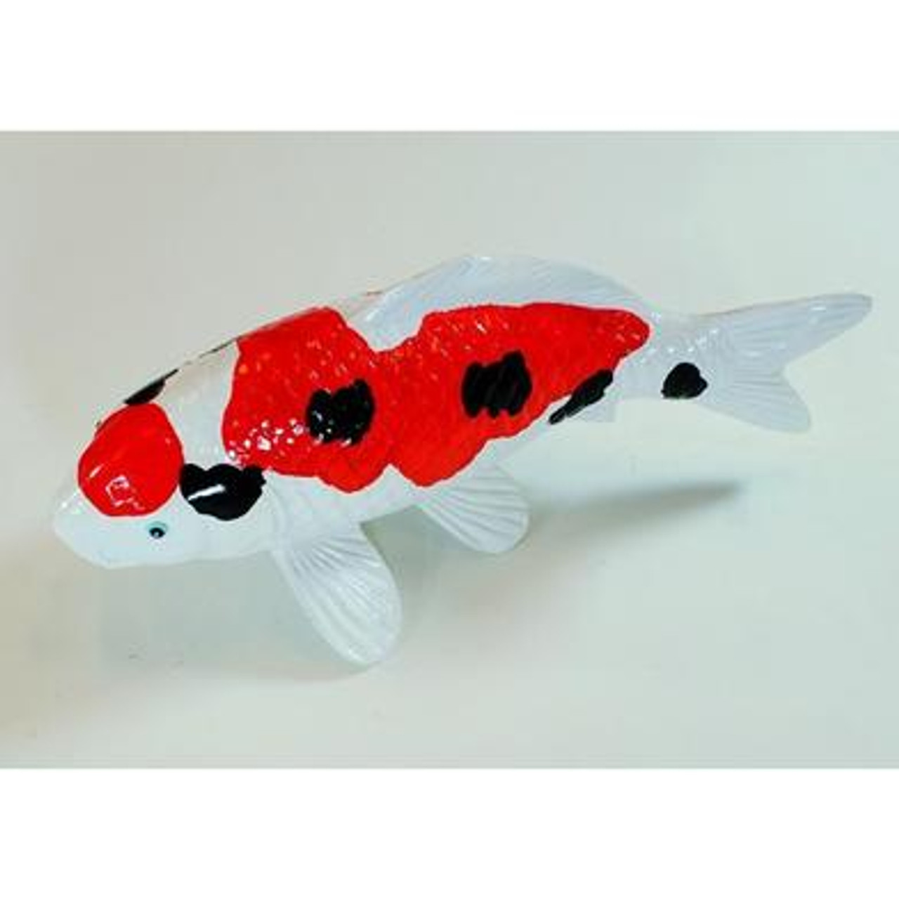 Overhead view of the koi replica highlighting the full body pattern and tail design.
