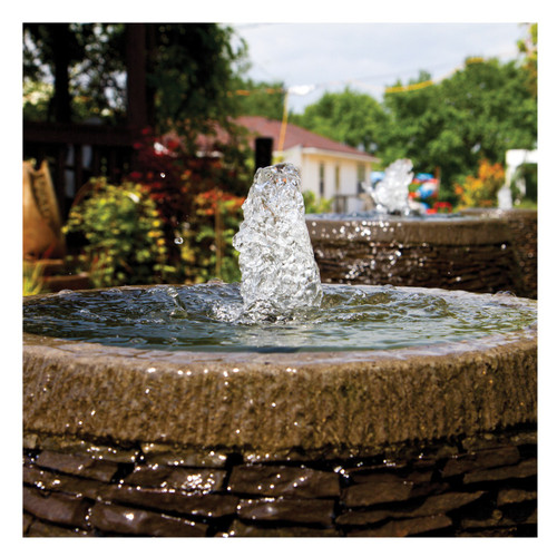 Outdoor fountain pump creating bubbling water feature in a stone basin. Outdoor fountain pump creating bubbling water feature in a stone basin.