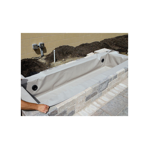 Flexible gray pond liner being installed inside a raised stone basin for custom water feature setup. Flexible gray pond liner being installed inside a raised stone basin for custom water feature setup.