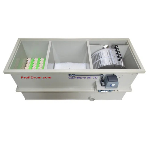Top View of CombiBio 50 TC, with the internal of the filter split into three compartments. Compartment on the right has steel mesh screens of 70 microns, 5-nozzle spray bar, and external drum motor. Compartment in the middle contains filter media, and compartment on the left contains Mountain Tree Filter Mat & Mountain Tree Bacteria House Cassette. One input/output hole visible on the front of filter for plumbing. Top View of CombiBio 50 TC, with the internal of the filter split into three compartments. Compartment on the right has steel mesh screens of 70 microns, 5-nozzle spray bar, and external drum motor. Compartment in the middle contains filter media, and compartment on the left contains Mountain Tree Filter Mat & Mountain Tree Bacteria House Cassette. One input/output hole visible on the front of filter for plumbing.