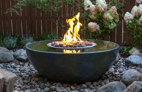 Front view of the 40-inch fire and water spillway basin installed in a garden at dusk, surrounded by river rocks and flowering shrubs, with water gently overflowing the rim and flames dancing in the center. Front view of the 40-inch fire and water spillway basin installed in a garden at dusk, surrounded by river rocks and flowering shrubs, with water gently overflowing the rim and flames dancing in the center.