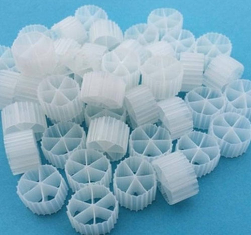 Front view of Bio Comb Fluidized Bed bio media pieces, showing a uniform array of small, blue plastic comb-shaped rings, each measuring approximately 0.63” × 0.4”. Front view of Bio Comb Fluidized Bed bio media pieces, showing a uniform array of small, blue plastic comb-shaped rings, each measuring approximately 0.63” × 0.4”.