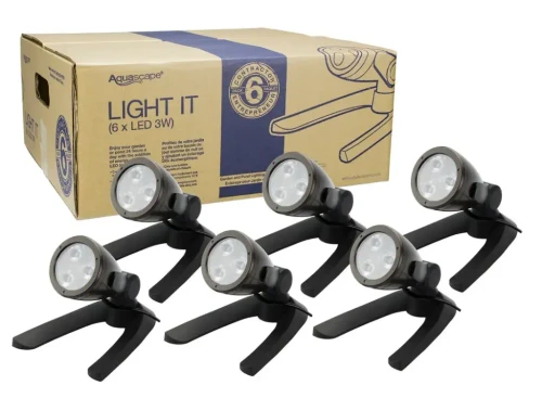 Aquascape 3-Watt LED Spotlight 6-Pack illuminating a garden pond at night
