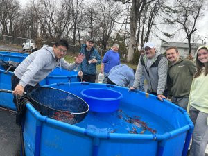 Kosuke Shows Customers Koi