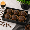 Six handcrafted Espresso Coffee Bombs arranged in a premium gift box with espresso-inspired styling by Bomb Confections.