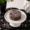 Birthday cake chocolate covered sandwich cookies with white chocolate drizzle and colorful sprinkles, available as a bulk order of 100 individually wrapped cookies for weddings, corporate gifts, and party favors.