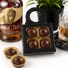 Bourbon bonbons in a black bottle hanger gift box with Buffalo Trace bourbon