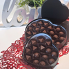 Black heart box filled with bourbon bonbons