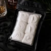 Bomb Confections 6-piece handmade bourbon marshmallows in a premium matte black gift pouch, crafted for gourmet s'mores, gifting, and bourbon-inspired desserts.