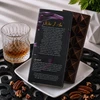 Back of Bomb Confections Old Fashioned Bourbon Chocolate Bar packaging displayed with the artisan geometric chocolate bar, featuring the product story, ingredients, allergen information, handcrafted branding, and candied orange peel accents inspired by a classic Old Fashioned cocktail.