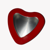 empty red heart tin