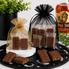 : Bourbon chocolate mini bars and Buffalo Trace pecan toffee packaged in small and large organza event favor bags