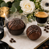 Espresso coffee bomb shown individually packaged and unboxed with espresso, white flowers and greenery for wedding and event favors.