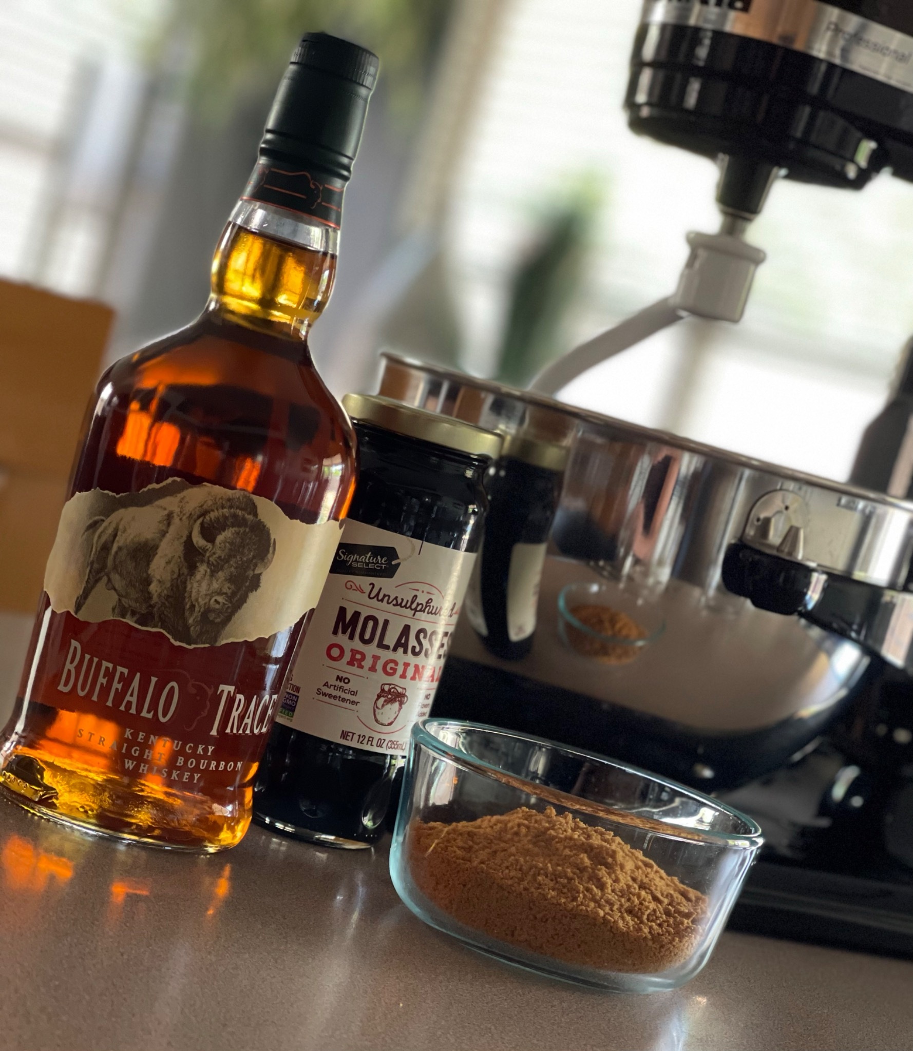 Buffalo Trace bourbon and ingredients set up in the Bomb Confections kitchen