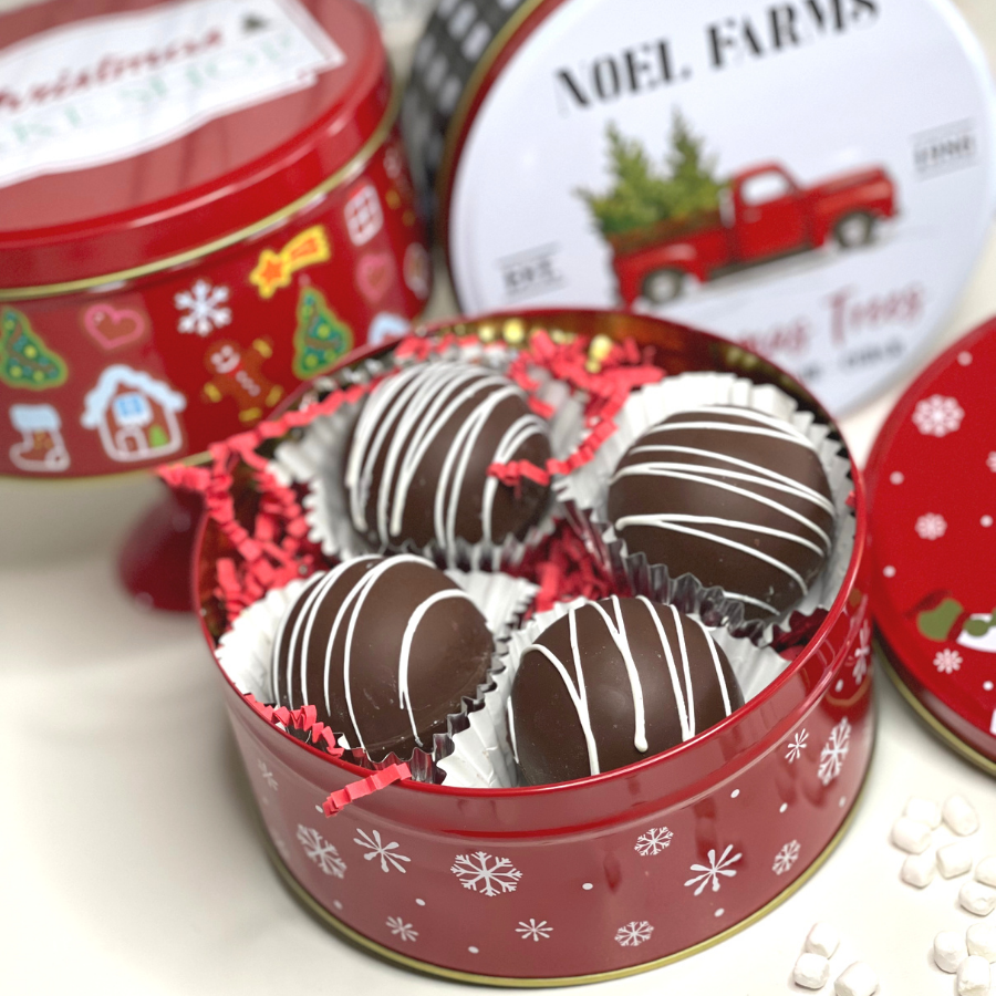 Early Bomb Confections cocoa bombs packaged in holiday tins