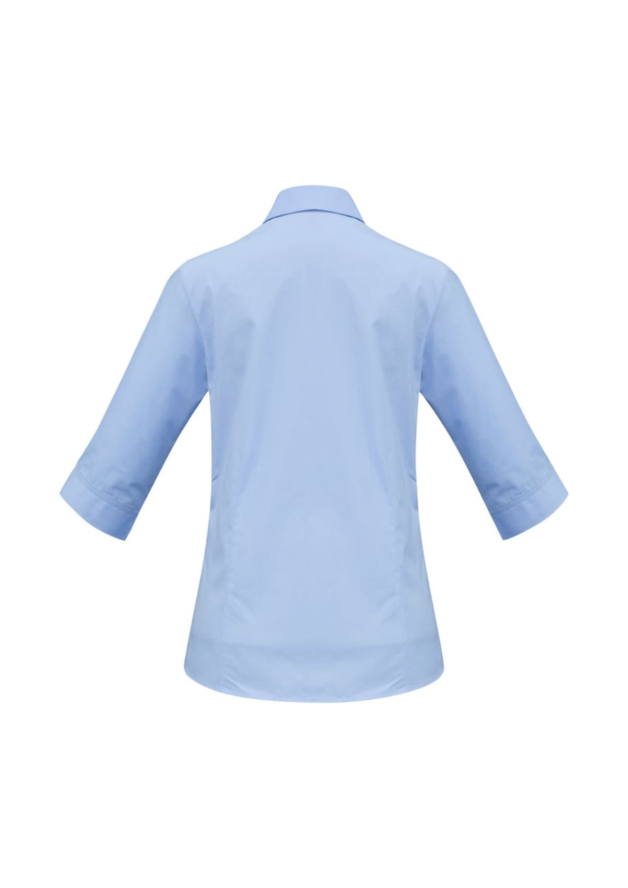 A women's 3/4 sleeve button-up shirt in light blue, featuring a back view with a smooth design and a logo.