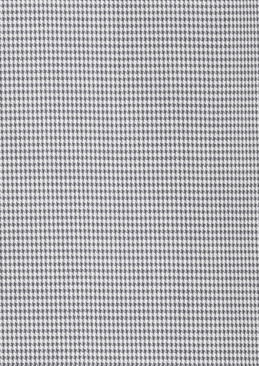 A textured fabric in a black and white houndstooth pattern, showcasing a classic design.