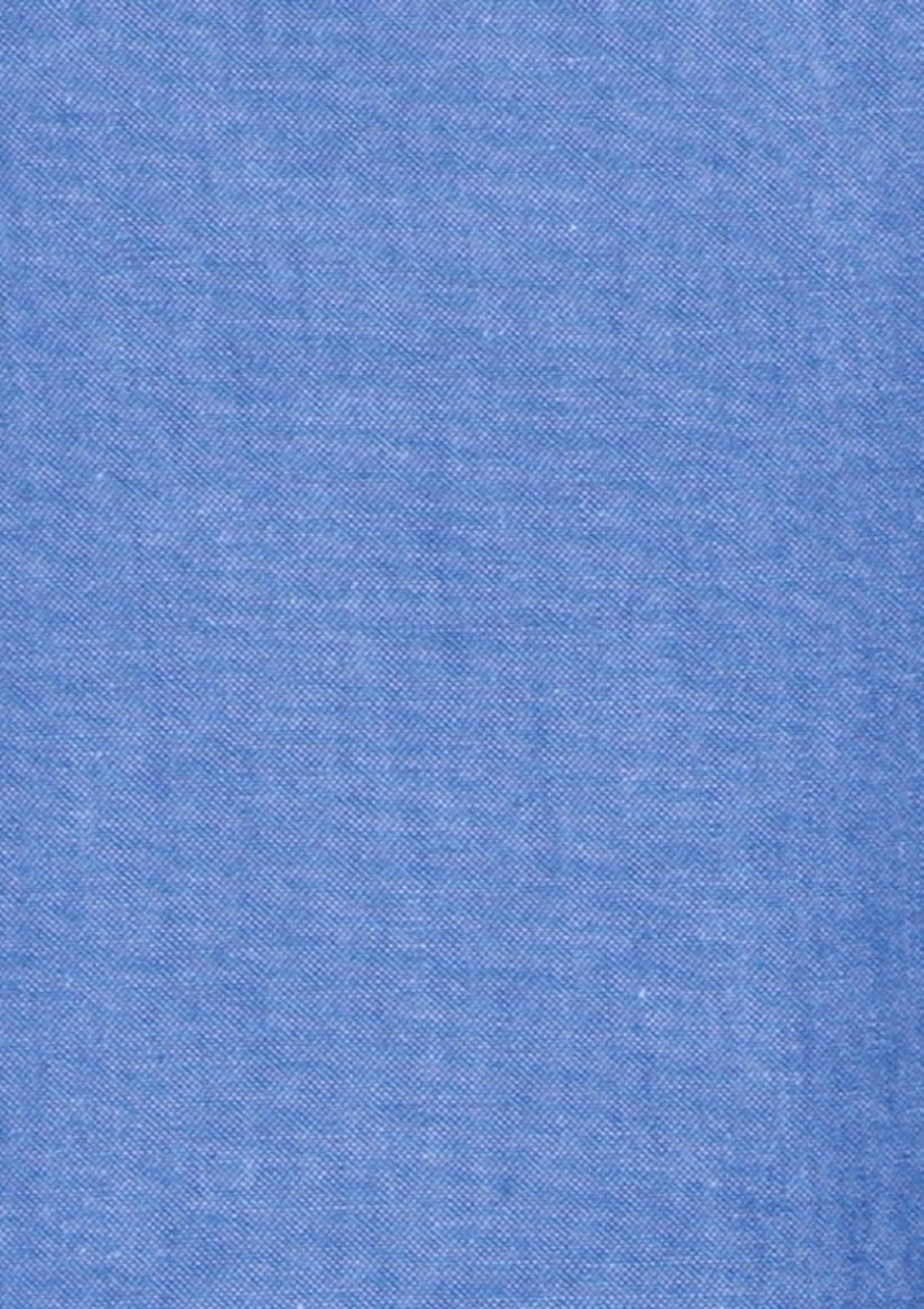 A chambray fabric in a light blue colour, featuring a smooth texture and consistent weave.